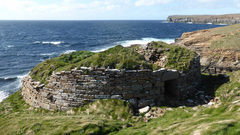 Remains of the Broch Of Borwick on the top of a cliff.