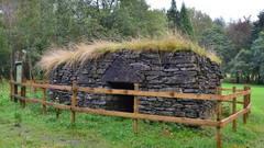 Reconstruction of part of a broch using Iron Age tools and techniques.